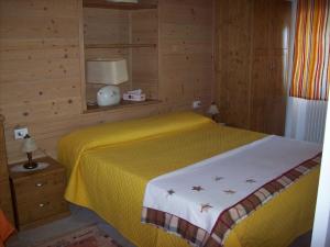A bed or beds in a room at Casa delle Camelie