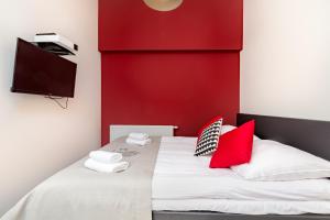 Posteľ alebo postele v izbe v ubytovaní Apartamenty City.