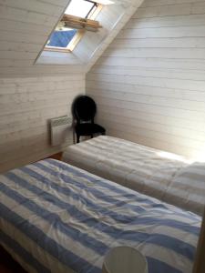 En eller flere senge i et værelse på Maison à Dinard