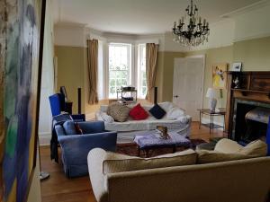 a living room with two couches and a fireplace at Clift Hill in Carlisle