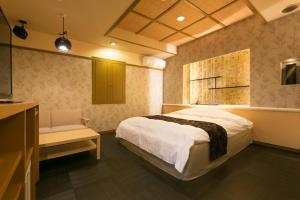 Postelja oz. postelje v sobi nastanitve Hotel Atlantis Higashi Osaka (Adult Only)