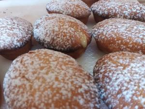 a bunch of donuts with powdered sugar on them at BB Gallipolis Terra in Gallipoli