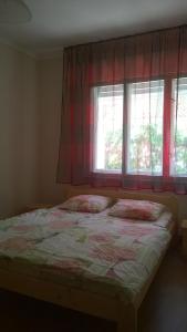 En eller flere senge i et værelse på Eva vendégház