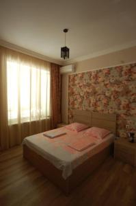 Postelja oz. postelje v sobi nastanitve Guest House Aisi