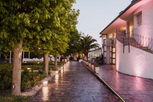 a cobblestone street with trees and a building at Hotel Ciudad de Borja in Borja