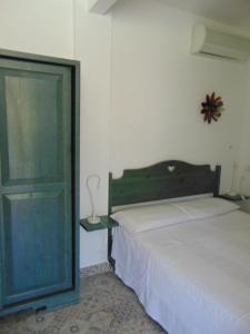 Letto o letti in una camera di B&B Dalla Nonna