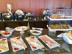 a buffet of food on a table in a restaurant at Master's Hotel - Ehden in Ehden