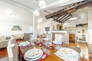 a dining room and living room with a table and chairs at Villa Boulder in Okrug Donji +88 photos
