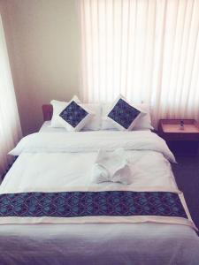 Uma cama ou camas num quarto em Hotel Nana Pokhara