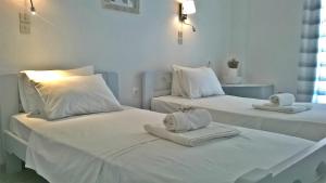 Postel nebo postele na pokoji v ubytování Hotel Faros