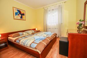 Ein Bett oder Betten in einem Zimmer der Unterkunft Guest House Katarina