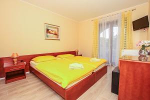 Ein Bett oder Betten in einem Zimmer der Unterkunft Guest House Katarina