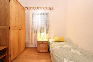 Postel nebo postele na pokoji v ubytování Apartments Zdravko