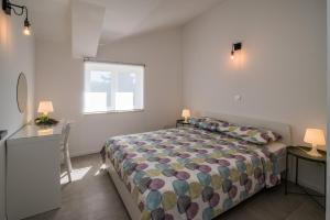 Posteľ alebo postele v izbe v ubytovaní Franko & Ana apartments