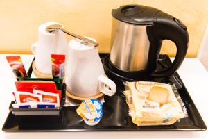 a black coffee maker sitting on top of a counter at Domus Popolo in Rome