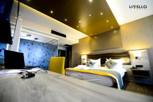 Postel nebo postele na pokoji v ubytování Livello Hotel