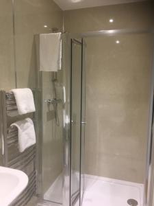 a bathroom with a shower and a sink at The Waterwheel in St Austell +81 photos