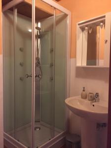 a bathroom with a shower and a sink at La Casina in Baveno +34 photos