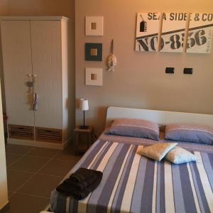 a bedroom with two beds with towels on them at Ca' di Bianca in Moneglia