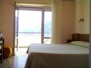 Postel nebo postele na pokoji v ubytování Hotel Glavjc