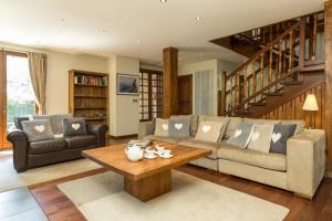 a living room with a couch and a coffee table at Villa Loppe in Chamonix-Mont-Blanc