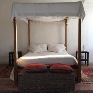Un pat sau paturi într-o cameră la B&B Corte Vo Grande