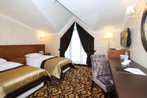 Postel nebo postele na pokoji v ubytování Arya Hotel Sakarya