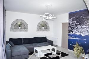 Posezení v ubytování TJ Apartment