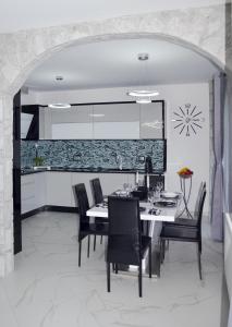 Posezení v ubytování TJ Apartment