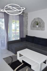 Posezení v ubytování TJ Apartment
