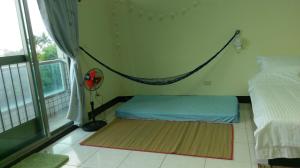 Postel nebo postele na pokoji v ubytování Dulan Groundnut Backpacker Hostel