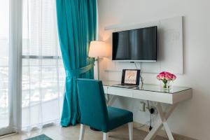 TV a/nebo společenská místnost v ubytování Jannah Marina Hotel Apartments