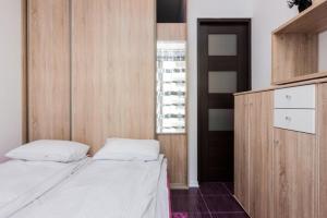 Posteľ alebo postele v izbe v ubytovaní Apartamenty Platan