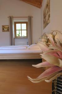 a bedroom with a bed and a window at Winklerhof in Parcines