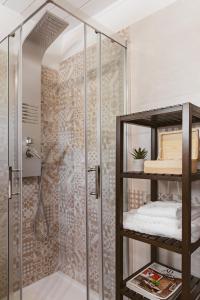 a bathroom with a shower with a glass enclosure at Miramonte Holiday in Montescaglioso