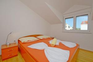 Apartments Marija tesisinde bir odada yatak veya yataklar