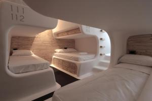 Postel nebo postele na pokoji v ubytování MyCocoon Hostel