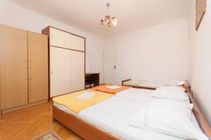 Postel nebo postele na pokoji v ubytování Apartment Slavko