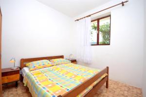 Postel nebo postele na pokoji v ubytování Apartments Kata