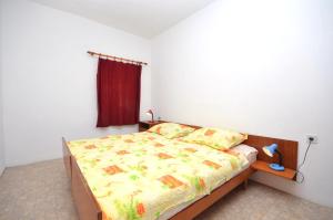 Postel nebo postele na pokoji v ubytování Apartments Kata