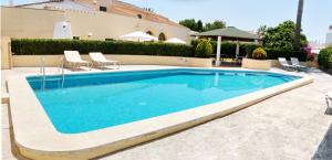 ein Pool vor einem Haus in der Unterkunft Hotel Rural Son Tretze - Adults Only in Sant Lluís
