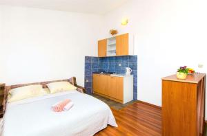 Postel nebo postele na pokoji v ubytování Apartments Tomislav