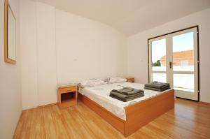 Postel nebo postele na pokoji v ubytování Apartments Renato