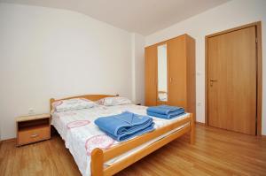 Postel nebo postele na pokoji v ubytování Apartments Renato