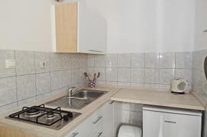 Kuchyň nebo kuchyňský kout v ubytování Apartments Zeljko