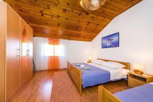 Postel nebo postele na pokoji v ubytování Apartment Sime