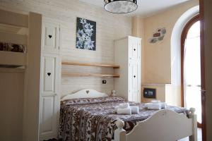 En eller flere senger på et rom på Hotel Piccolo Parco