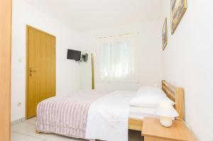 Postel nebo postele na pokoji v ubytování Apartment Antonio