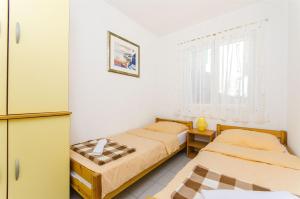 Postel nebo postele na pokoji v ubytování Apartment Antonio