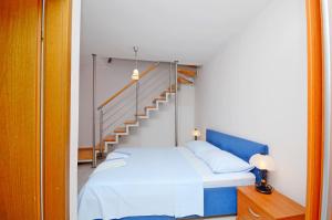 Postel nebo postele na pokoji v ubytování Apartments Hrgovic